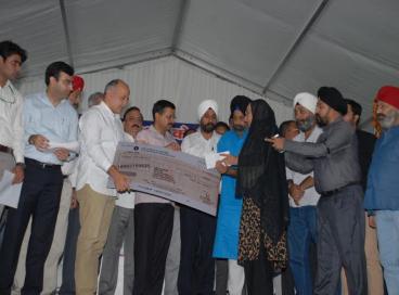 CM and Dy CM begin cheques distribution of Rs 5 lakh each to 1984 riots victims, 01st November 2015